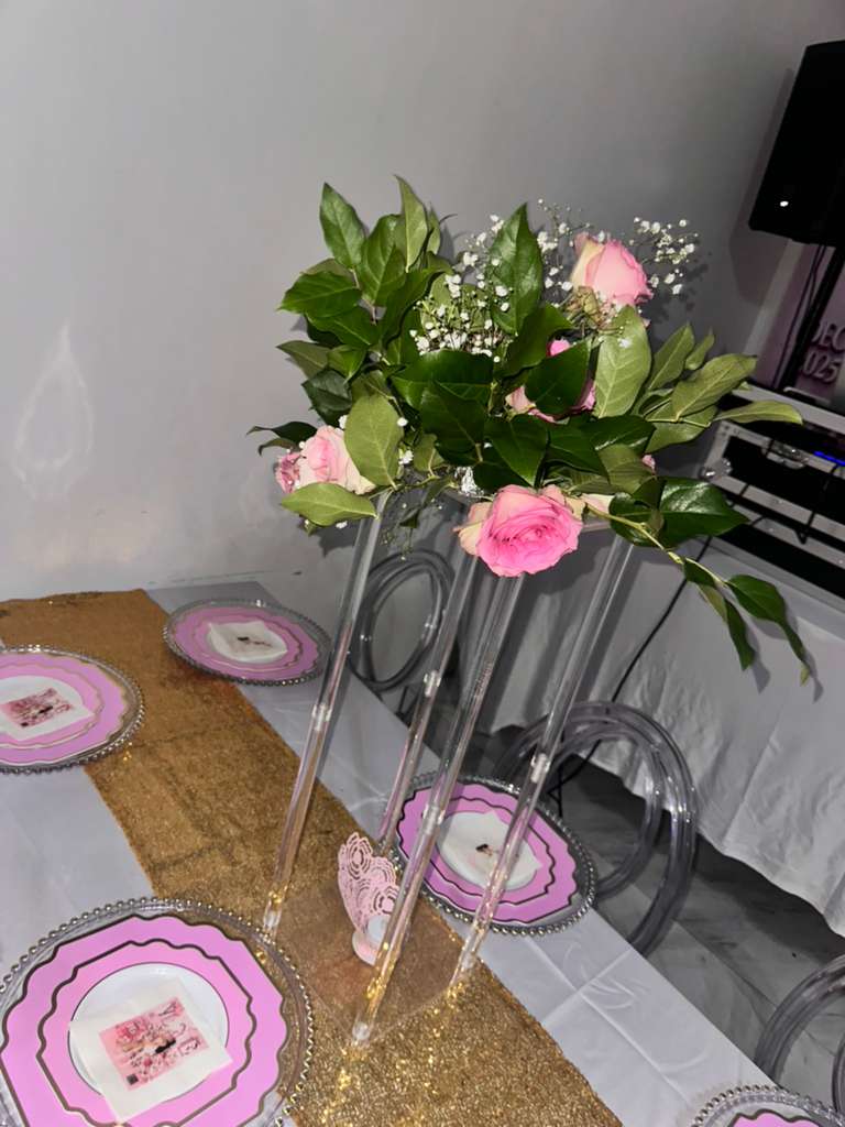 Festive table setting with candles and roses for a holiday party at Elegance on Varet